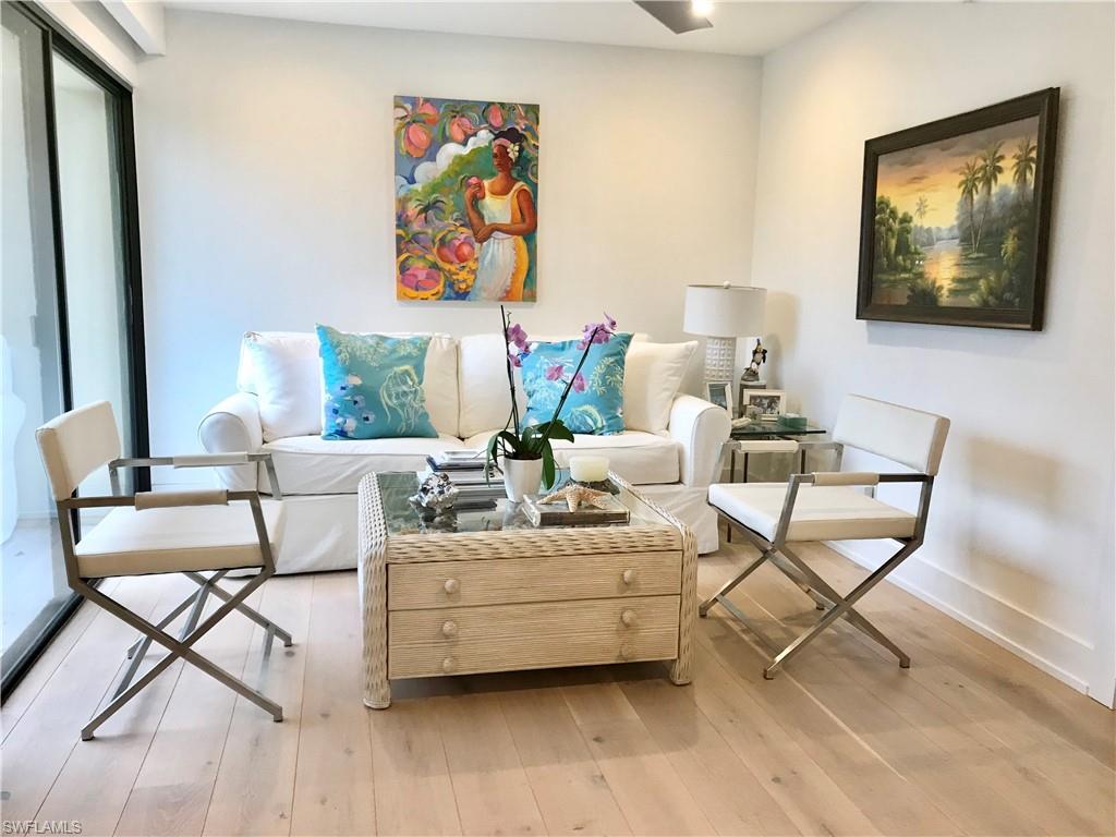 Sitting room with light wood finished floors and baseboards