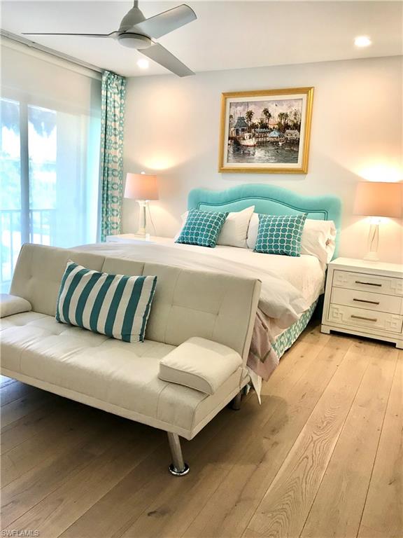 Bedroom featuring light wood finished floors, a ceiling fan, and recessed lighting