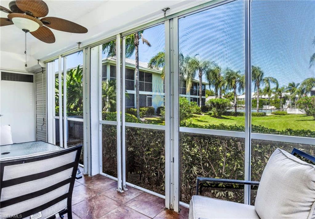 Screened patio with terracotta tile flooring