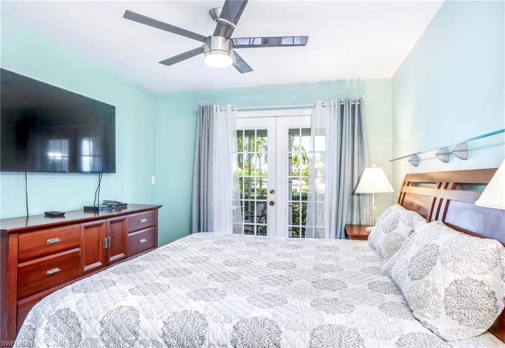 Bedroom featuring french doors with glass panes, leading to an outdoor area