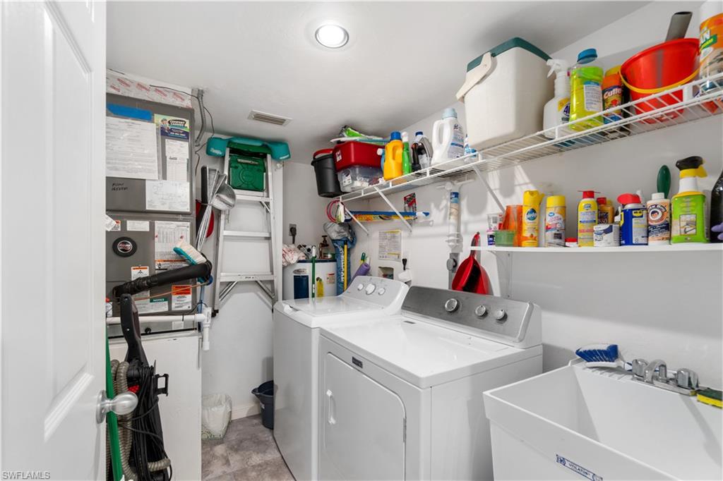 Laundry room with extra storage and a sink.