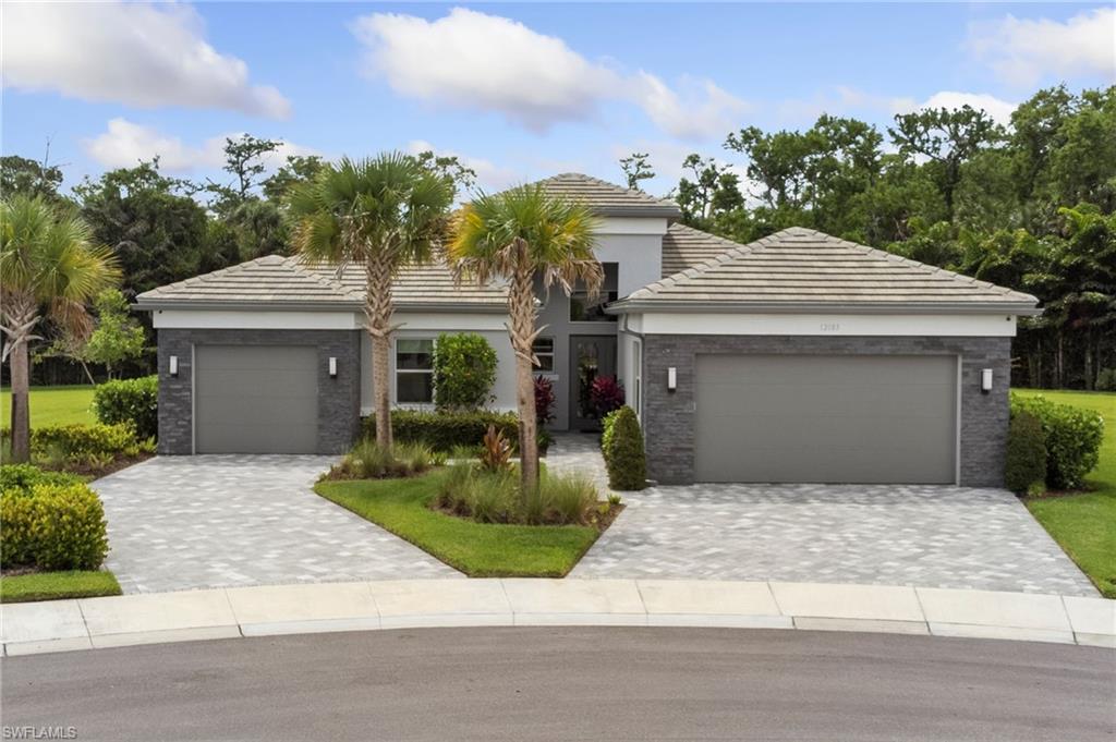 Beautiful curb appeal, with dual driveways.