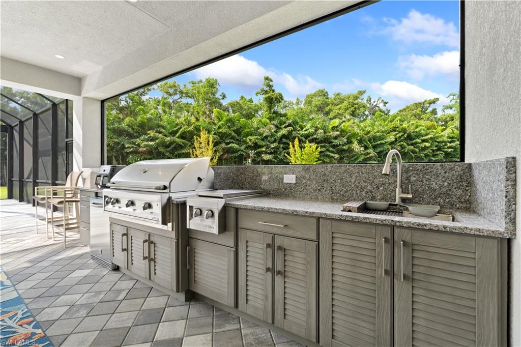 Features well appointed outdoor kitchen