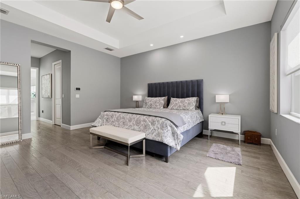 Primary suite with 3 walk in closets.
