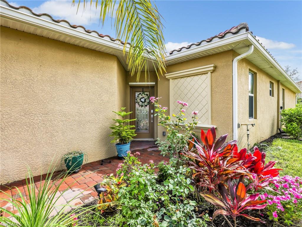 Stucco exterior with a tiled roofline