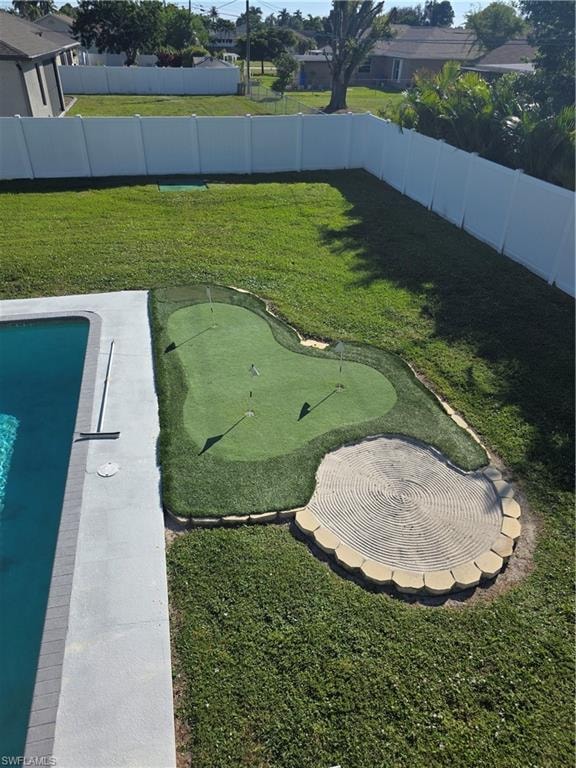 3 Hole golf green with sand trap and pitching mat.