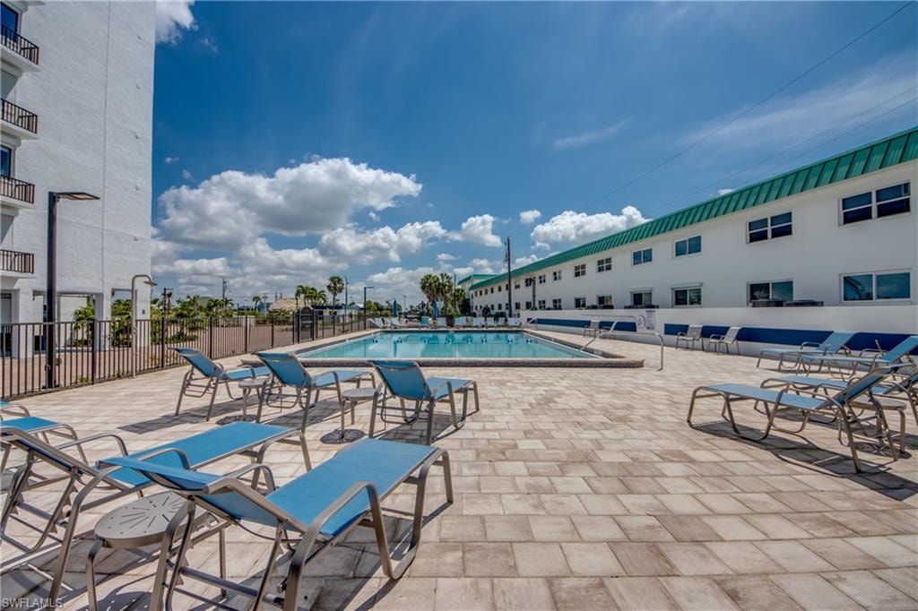 Outdoor swimming pool with a surrounding paver patio