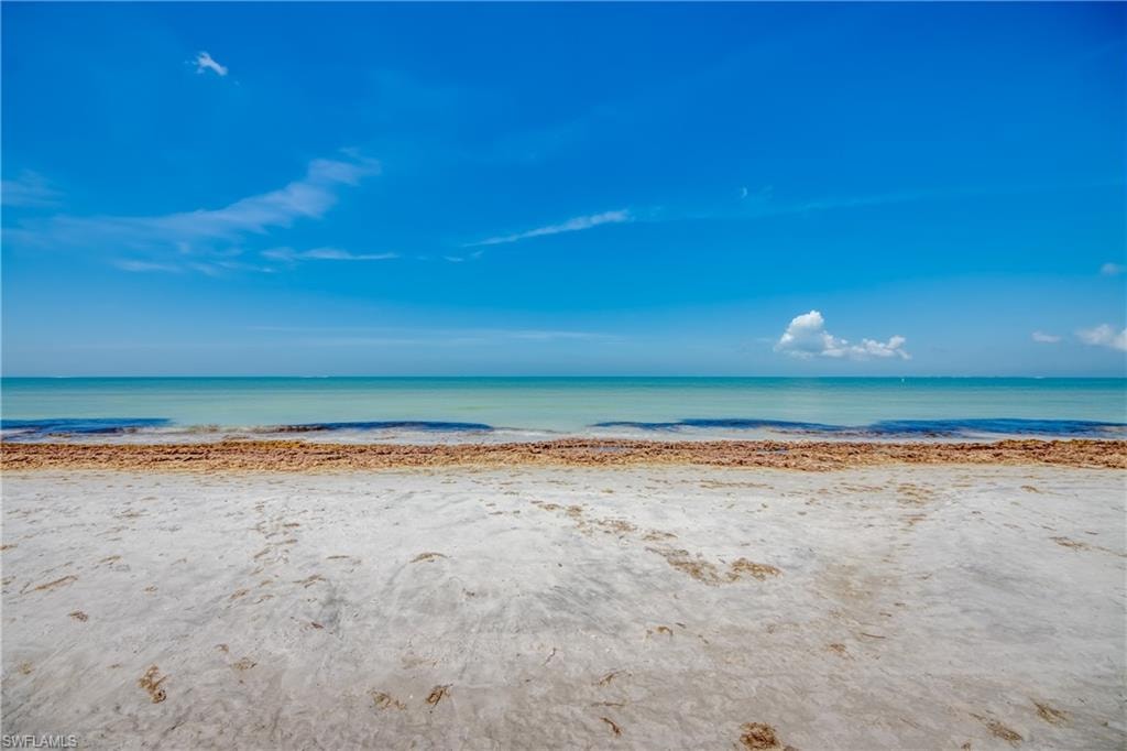 Expansive sandy beach with clear ocean waters