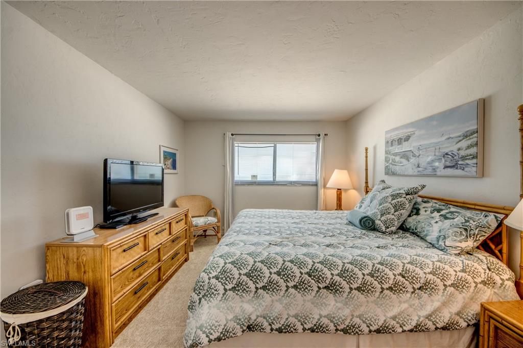 Carpeted room featuring light-colored walls and a window with horizontal blinds