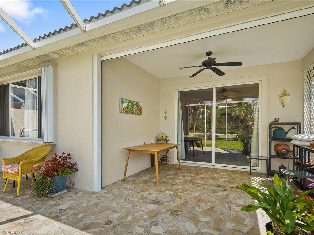 Screened lanai featuring irregular-patterned tile flooring
