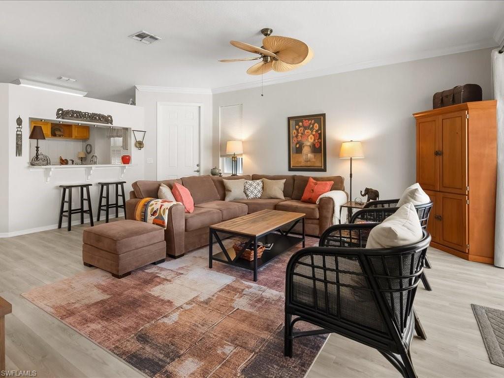 Light wood-finish flooring complements a neutral wall palette