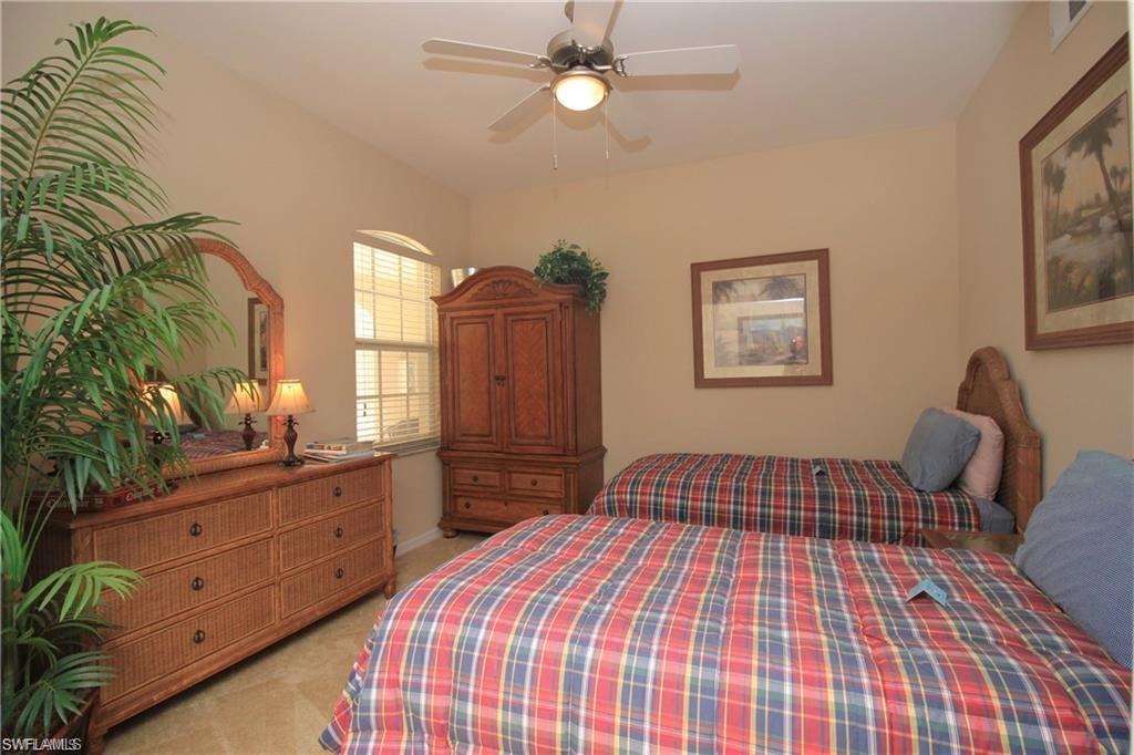 Bedroom with light carpet and ceiling fan