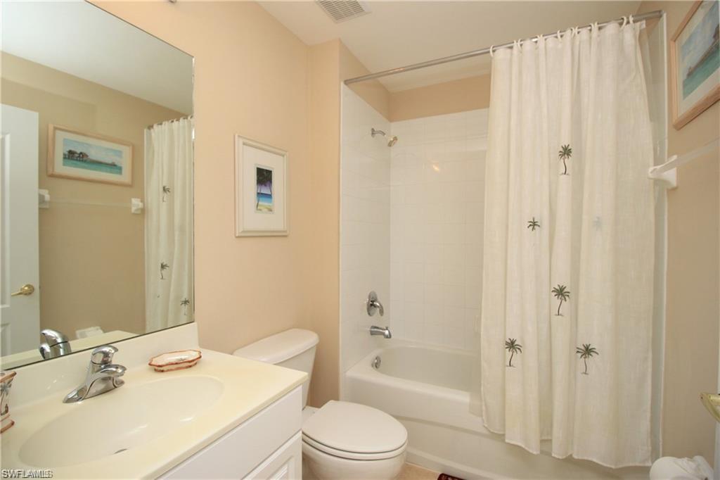 Full bathroom with vanity, toilet, and shower / tub combo