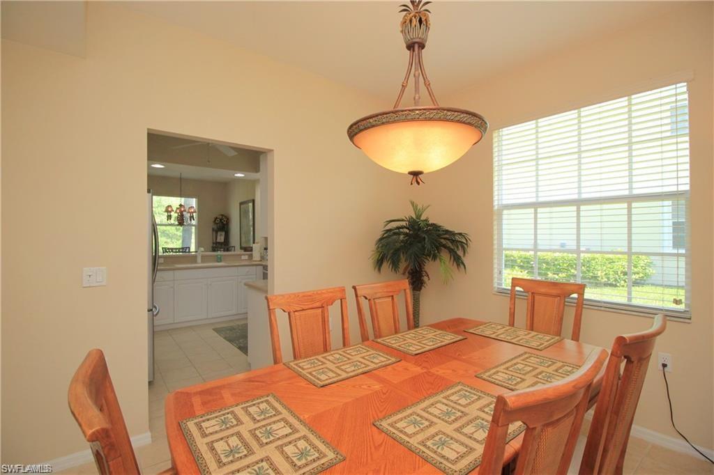 Tiled dining room featuring sink