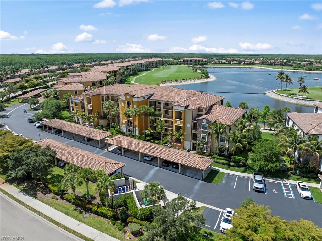 Multi-story residential buildings featuring tiled roofs and covered parking structures
