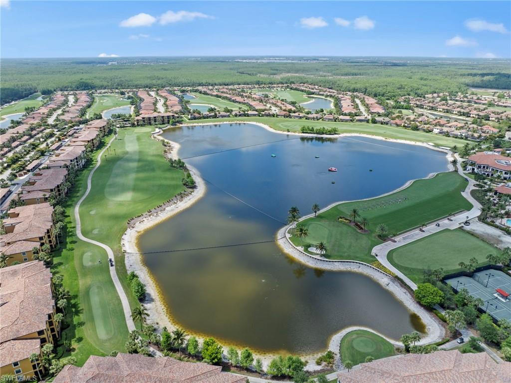 Aerial perspective showcasing a golf course community with extensive water features