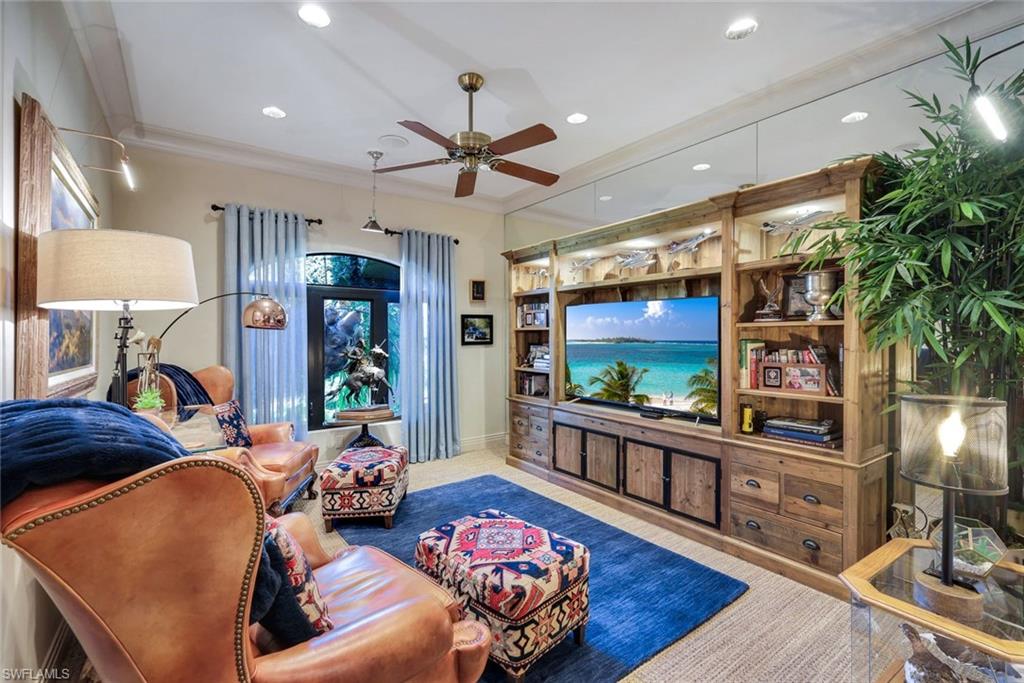 Custom built-in media console featuring extensive cabinetry and display shelving