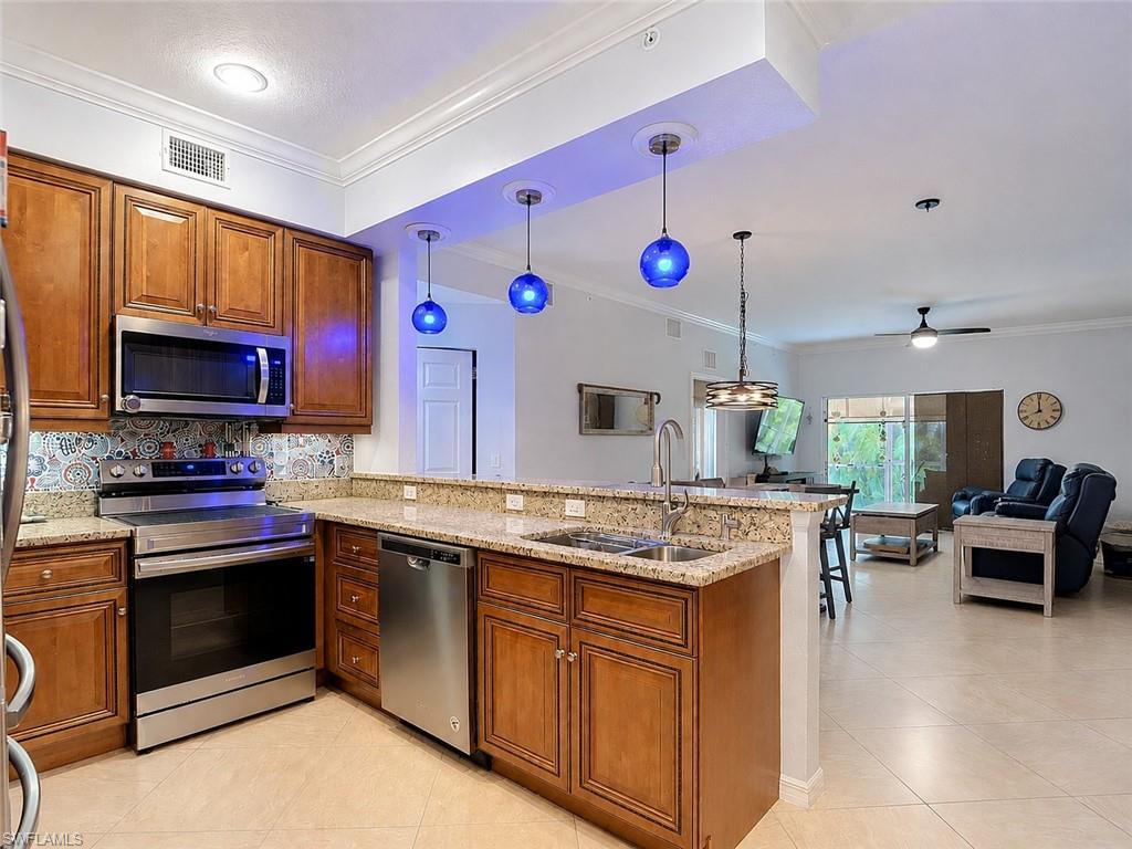 Kitchen featuring decorative tile backsplash and Open Concept Dinning and Living Room Area