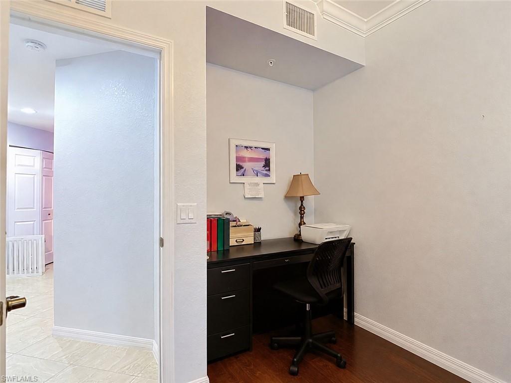 Dedicated office nook featuring wood-finish flooring