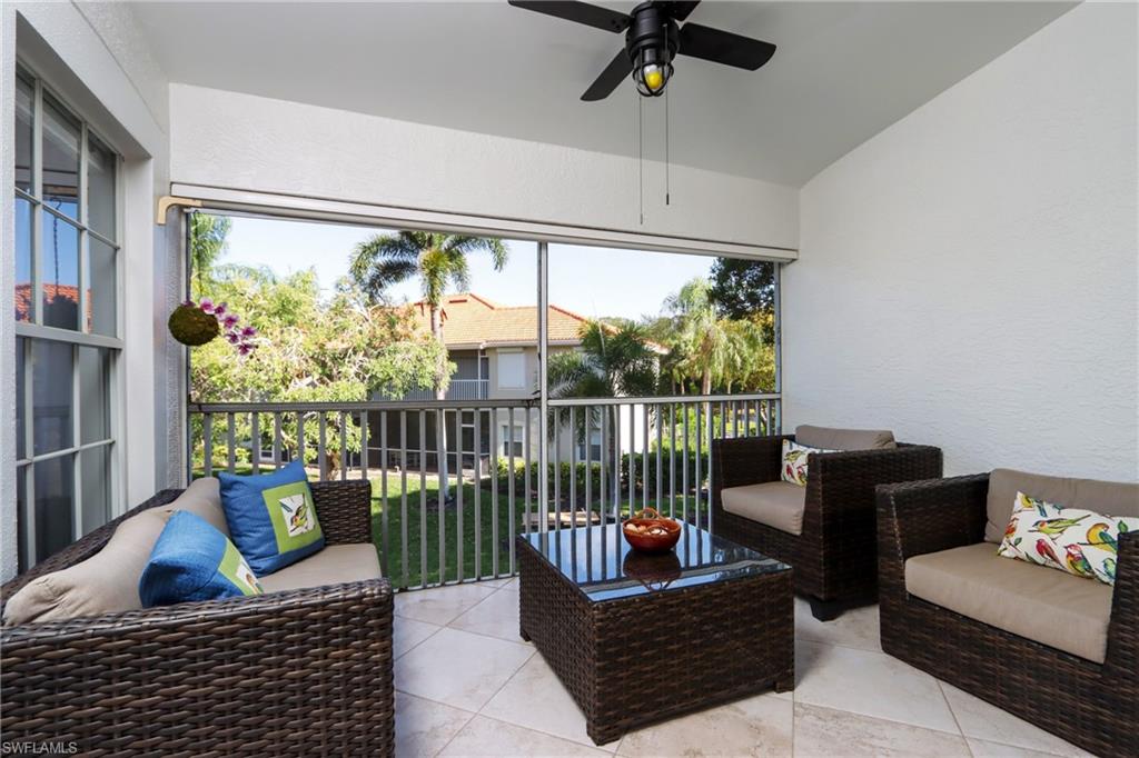 Sunroom with a ceiling fan, outdoor lounge area, and vaulted ceiling