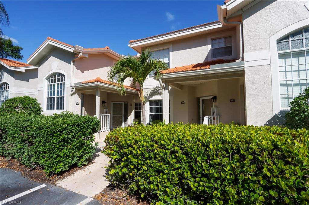 View of exterior entry with stucco siding