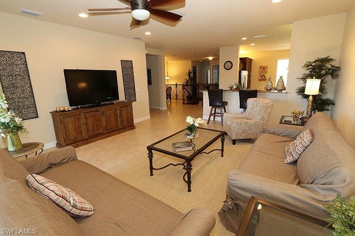 Tiled living room with ceiling fan