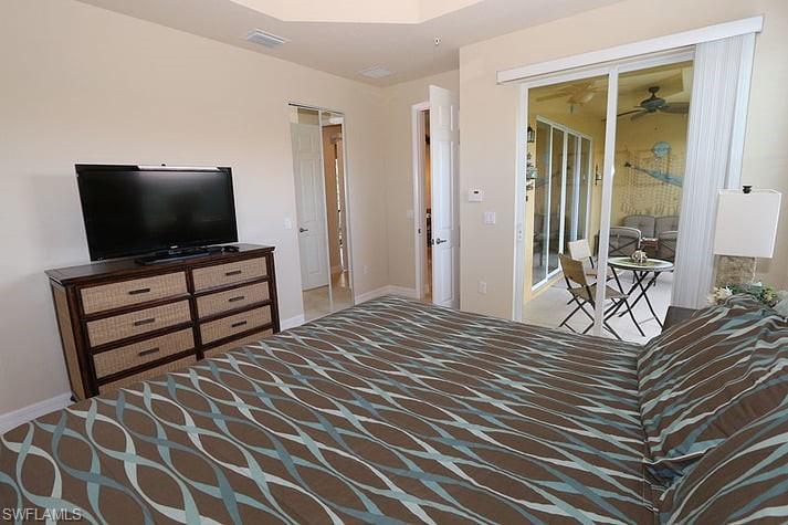 Bedroom with access to exterior and carpet flooring