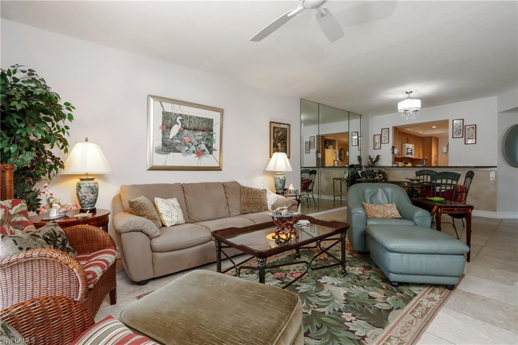 Living room with ceiling fan and baseboards