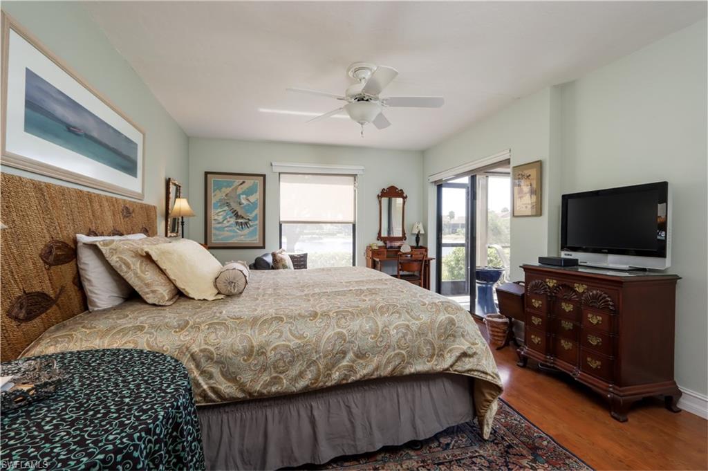 Bedroom with wood finished floors and ceiling fan
