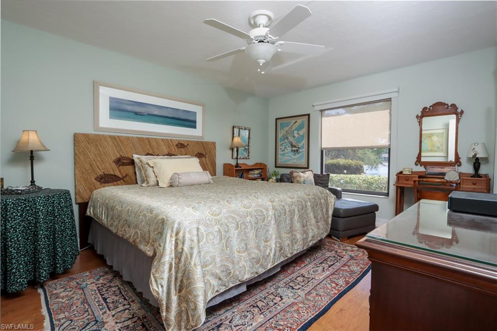 Bedroom with wood finished floors and ceiling fan