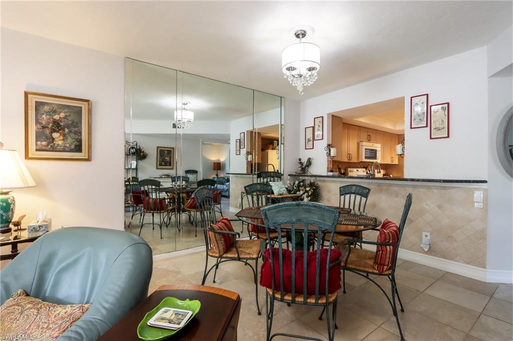Dining room featuring a chandelier and light tile patterned floors