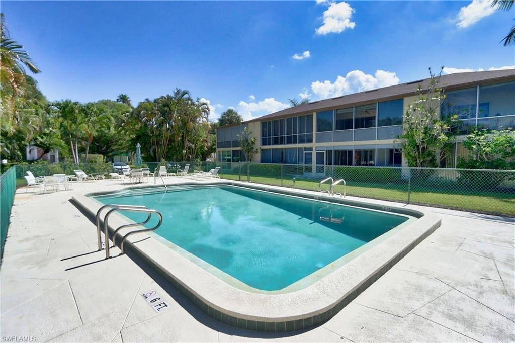View of pool with a yard and a patio