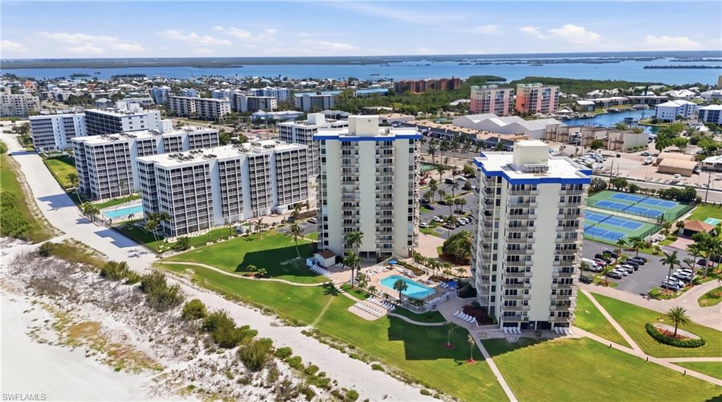 Coastal high-rise buildings featuring private balconies and resort-style amenities - Virtually Edited Image