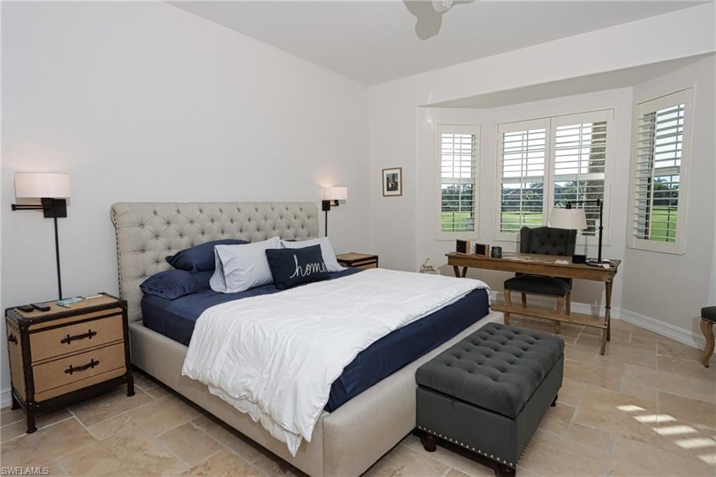Tiled bedroom with ceiling fan