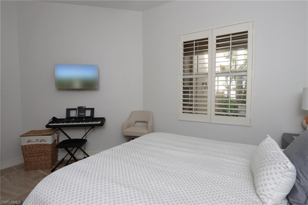 Bedroom with tile patterned floors