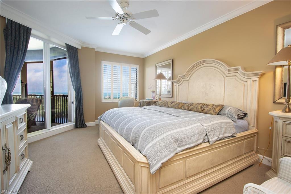Carpeted bedroom featuring ornamental molding, ceiling fan, and access to outside