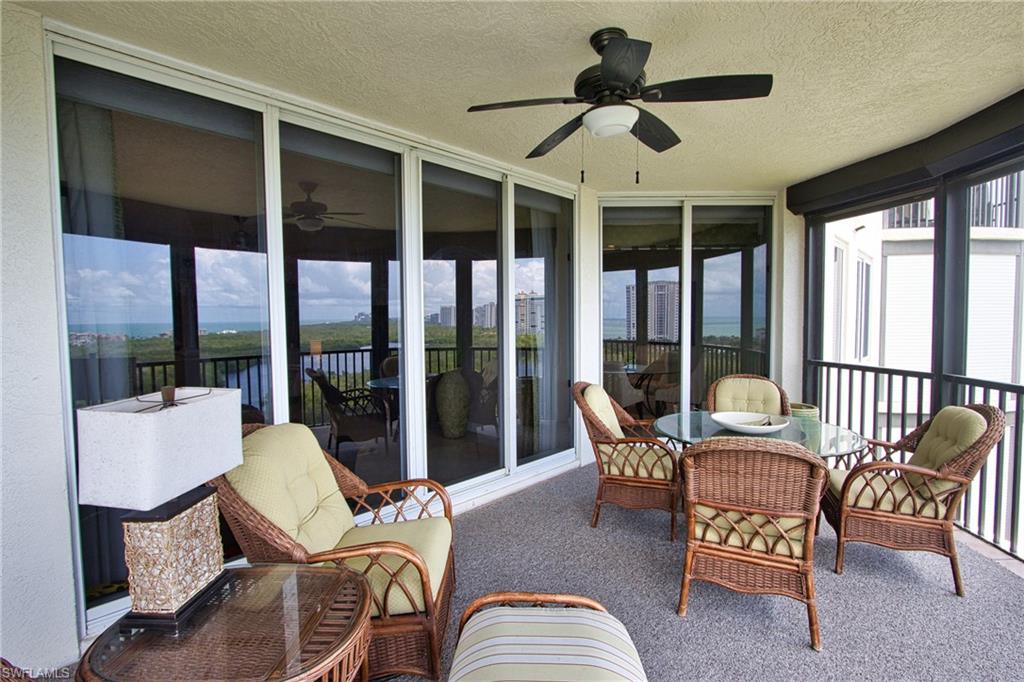 Sunroom / solarium featuring ceiling fan