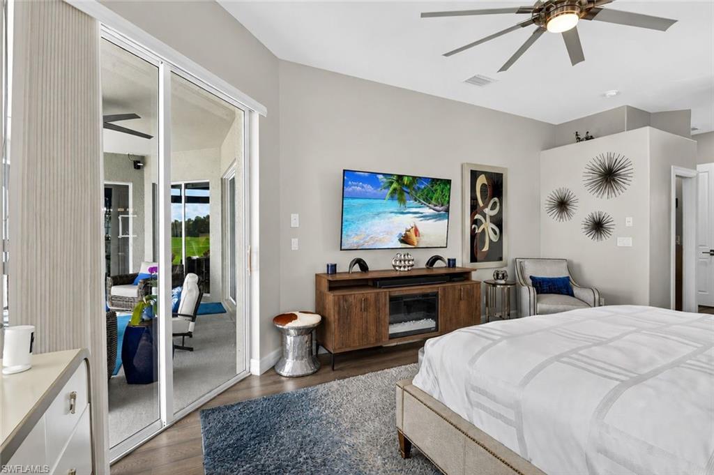 Spacious interior featuring Volume ceilings, sliding glass doors to a screened outdoor living area