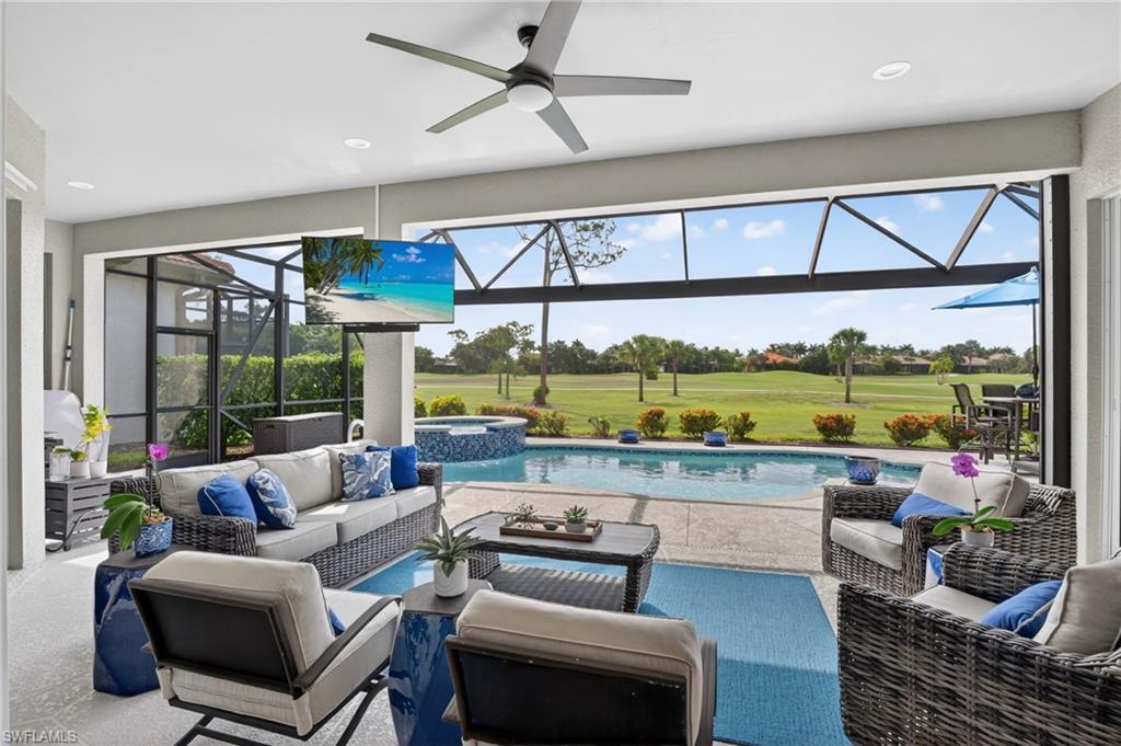 Screened Lanai with large covered living space, Storm Smart Shutters, a built-in pool and integrated spa and serene golf course views