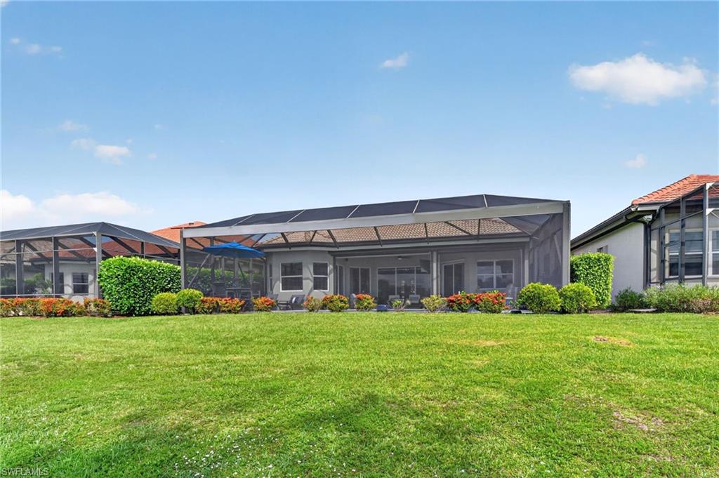 Expansive green space beyond lanai cage