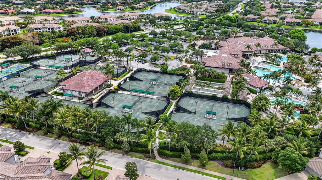 Players Club and Spa: Extensive facilities featuring multiple courts, two club houses, and surrounding lush tropical landscaping