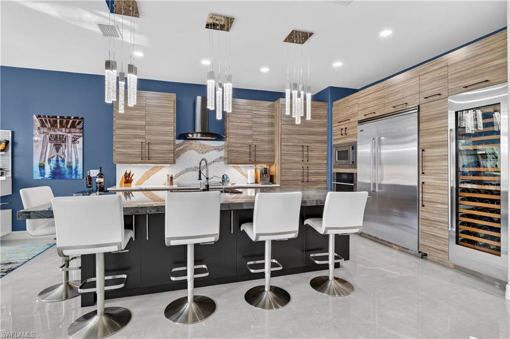 Modern kitchen featuring wood-finish cabinetry, Viking appliances, and a Sub Zero built-in wine refrigerator
