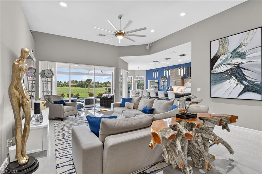 Living area with volume ceilings, recessed lighting, and stunning views