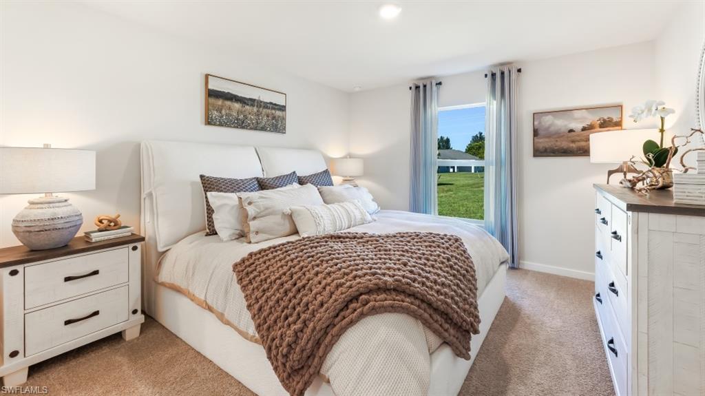 MODEL PHOTO - Bedroom featuring light carpet and recessed lighting