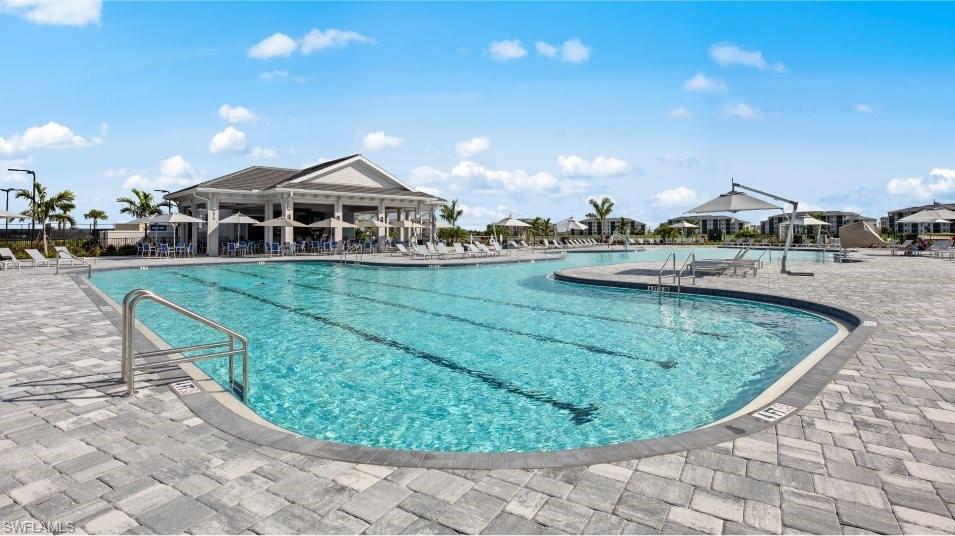 Community pool featuring a patio