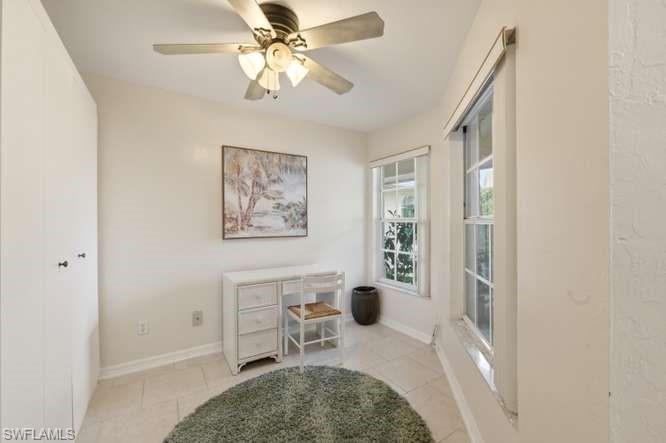 Den with a Murphy bed, with attached powder room