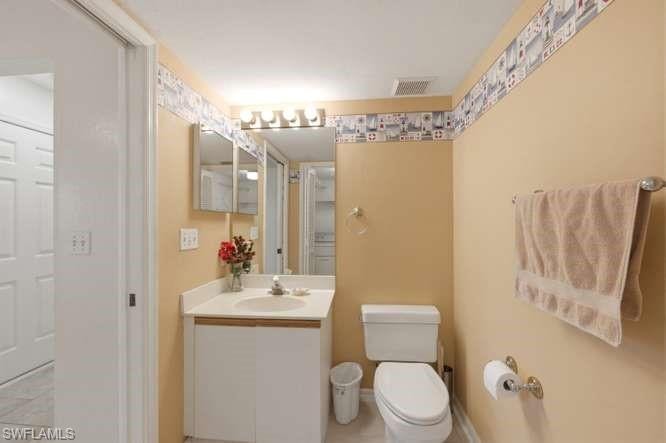 Half bath attached to den on 1st floor