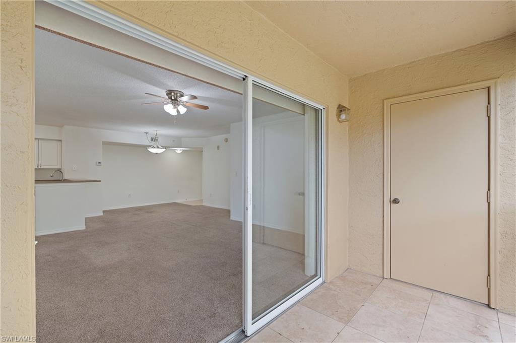 Balcony with a patio area and ceiling fan