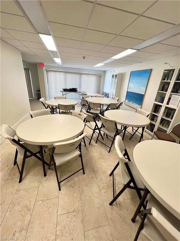 Community room featuring neutral tile flooring for gatherings