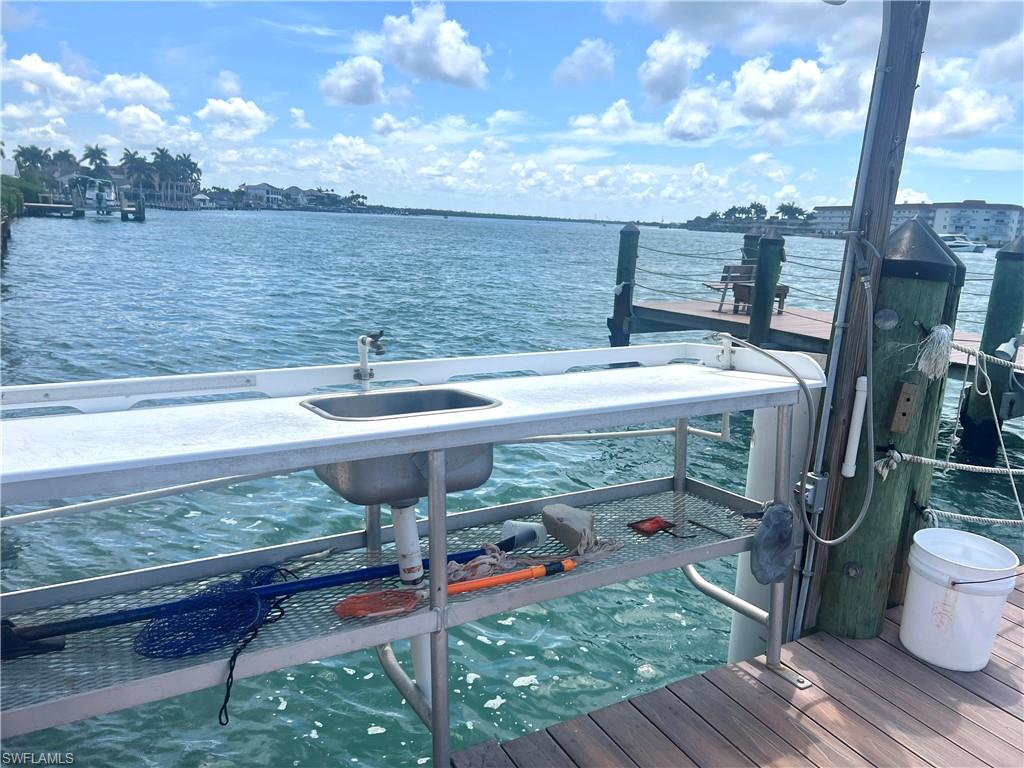 Waterfront pier featuring 2 built-in l sinks with plenty of counter space